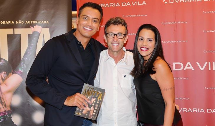 O ex-jogador de futebol Neto com sua esposa e Leo Dias